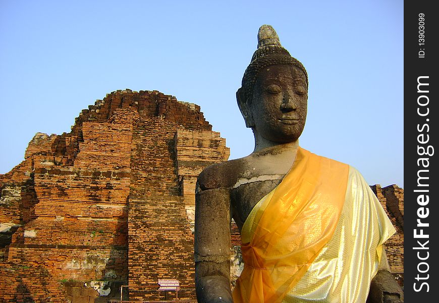 Buddha and Ancient Pagoda in Ayutthaya, Thailand