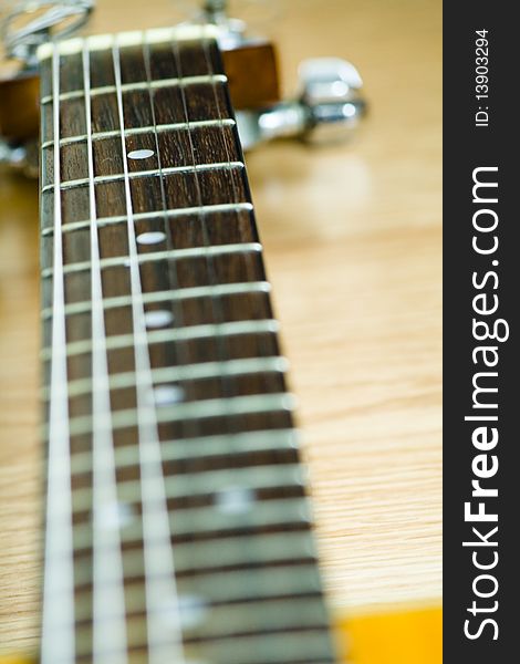 A seven-string acoustic guitar's finger board