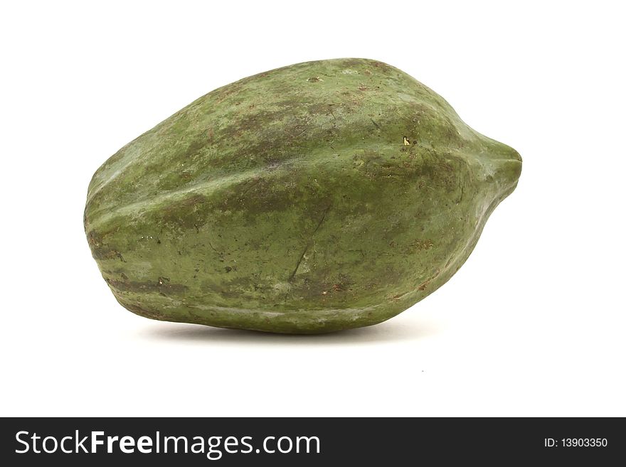 Green Papaya popular in Thai cooking and salads against white background.