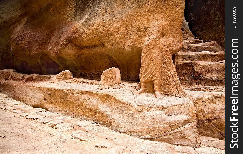 Remains of ancient statues in the Siq in Petra, Jordan