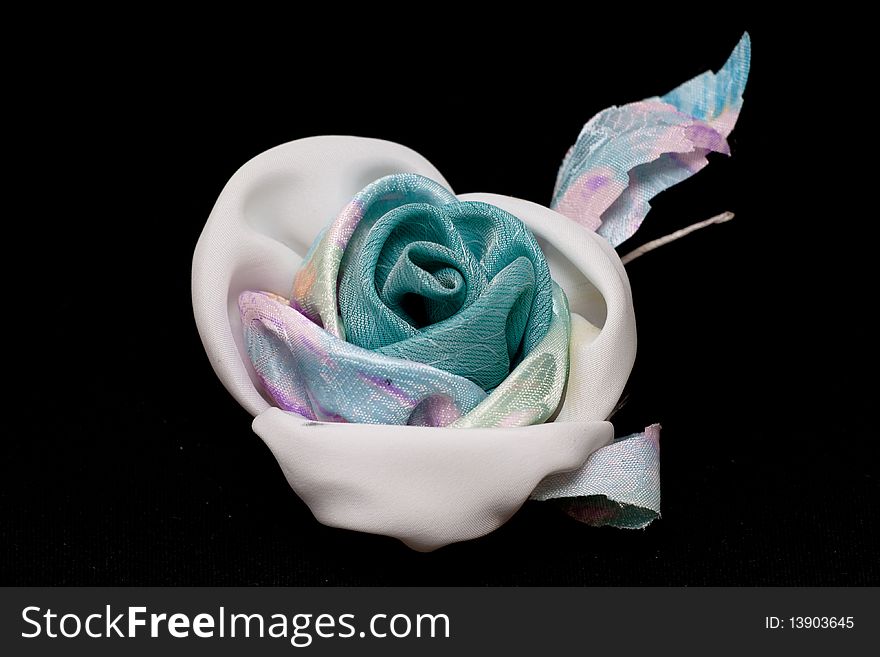Artificial blue and white handmade rose on black. Artificial blue and white handmade rose on black