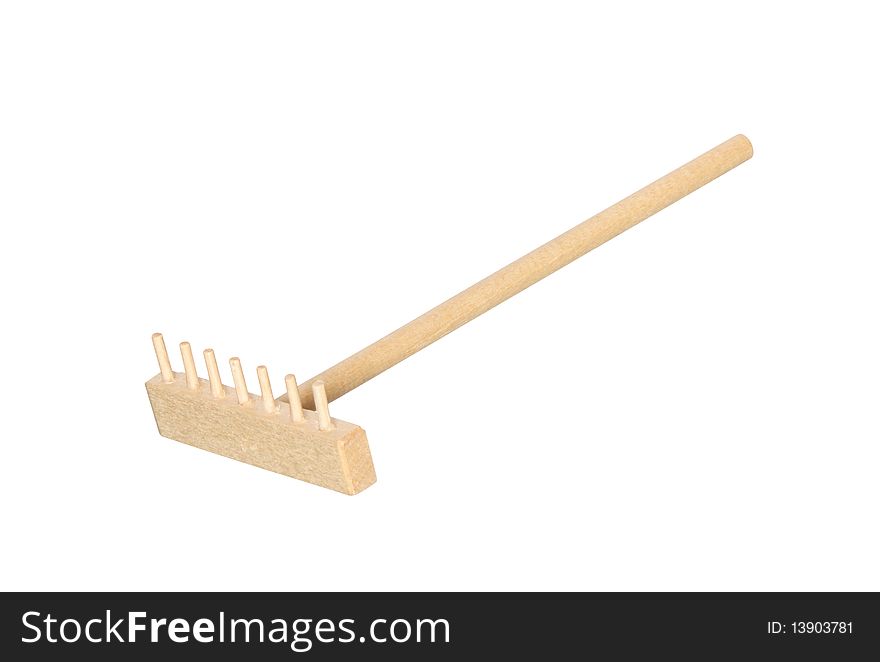 Wooden rake isolated on white background with clipping path