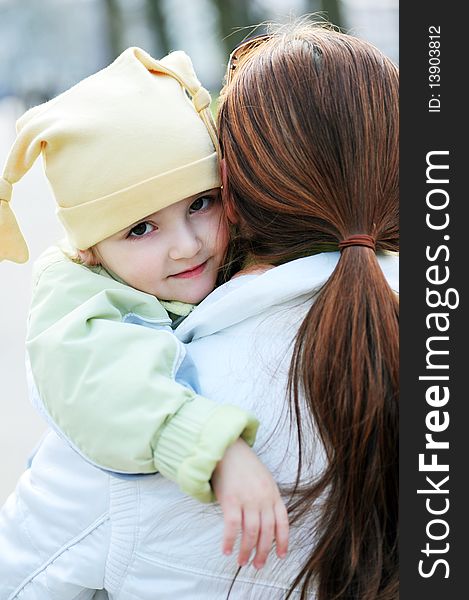 Mother holds  little girl on hands. Mother holds  little girl on hands