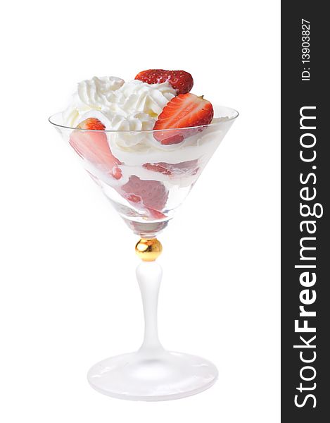 Fresh chopped strawberries with whipped cream in glasswares