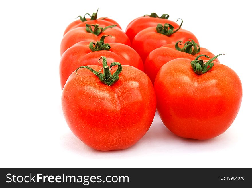 A few red tomatoes isolated on white