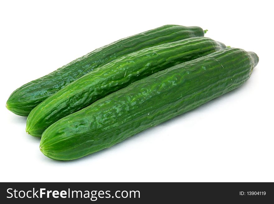 A fresh green cucumber isolated on a white background