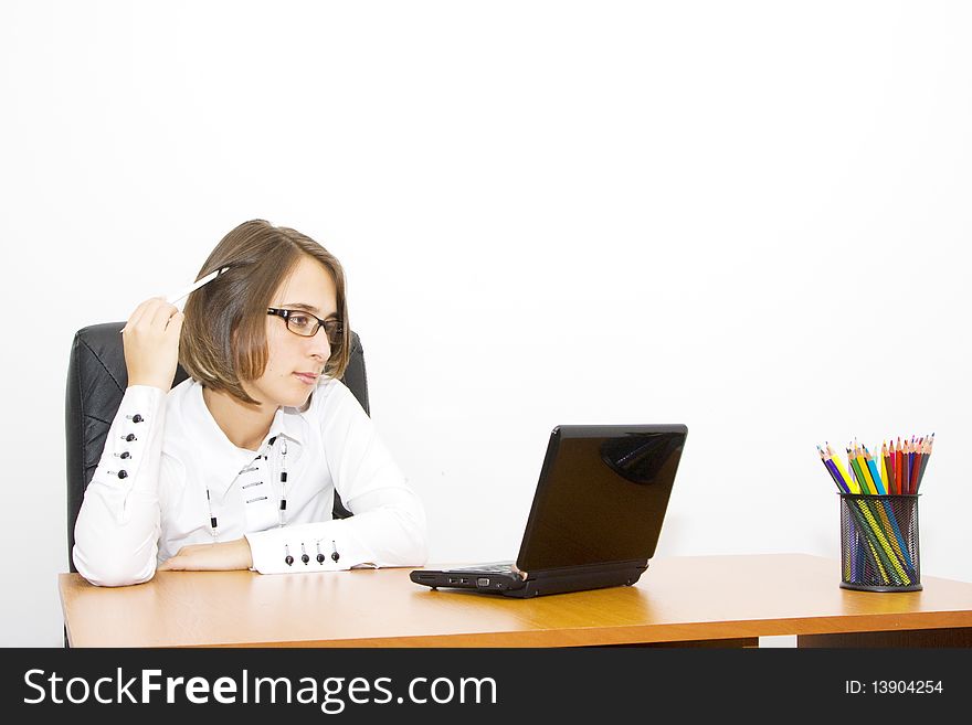 Beautiful young woman at the office, indoor shoot