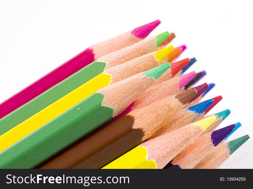 Brunch of colored crayons on white background