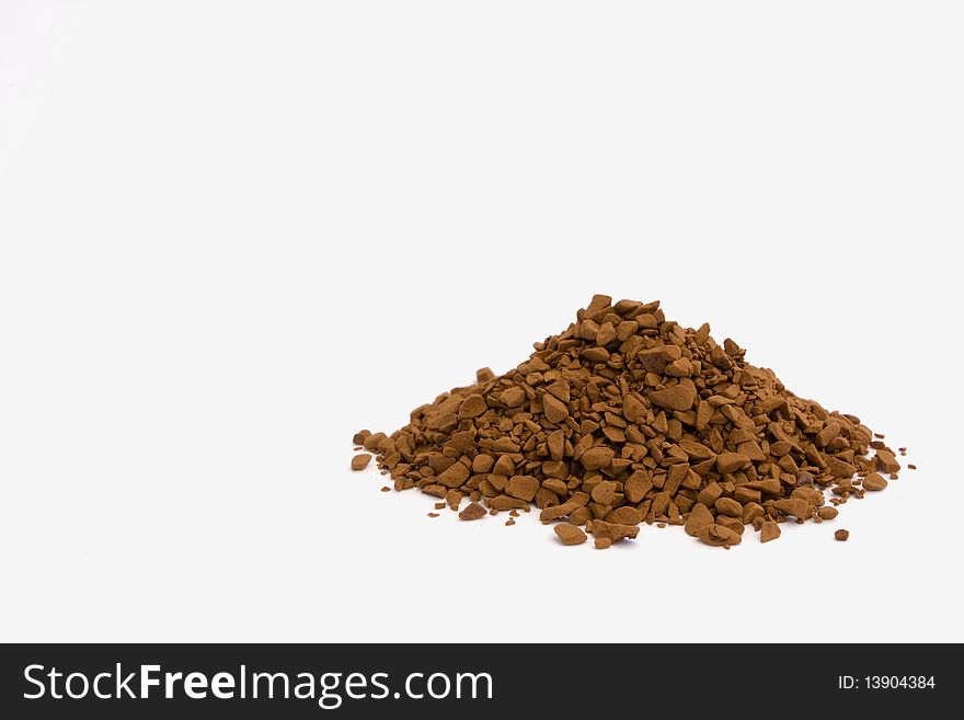 Instant coffee granules on white