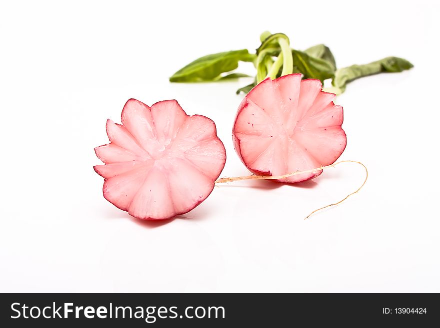 Succulent radish sliced in attractive manner from low viewpoint against white background. Succulent radish sliced in attractive manner from low viewpoint against white background.