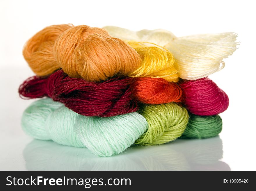 Pile of different color wool and cotton threads