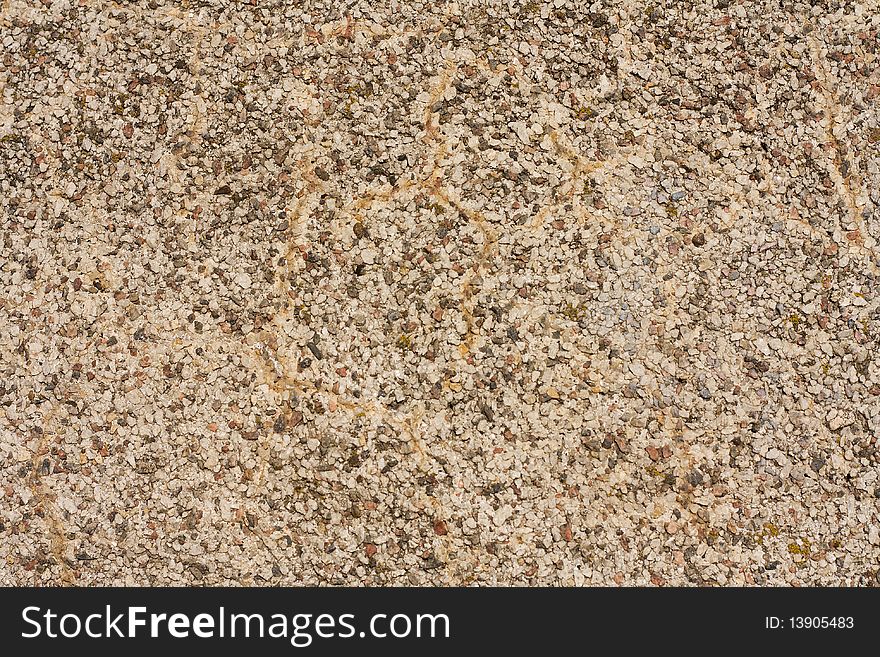 Surface covered with small stones - a picture for a texture or a background. Natural light in a sunny day. Surface covered with small stones - a picture for a texture or a background. Natural light in a sunny day