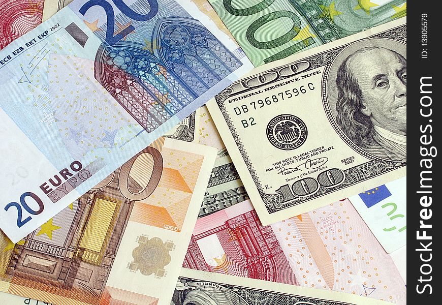 Cash background: heap of euros and dollars banknotes. Cash background: heap of euros and dollars banknotes