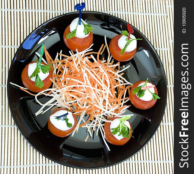 Arrangement of delicious mozzarella and tomatoes appetizer. Arrangement of delicious mozzarella and tomatoes appetizer