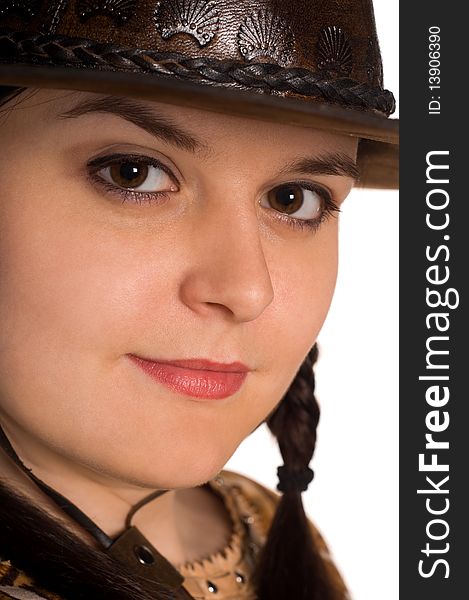 Beautiful young caucasian girl in a cowboy hat over white background. Beautiful young caucasian girl in a cowboy hat over white background