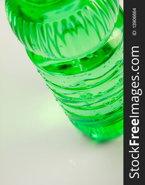 A plastic bottle filled with still water. Image isolated on white studio background. A plastic bottle filled with still water. Image isolated on white studio background.