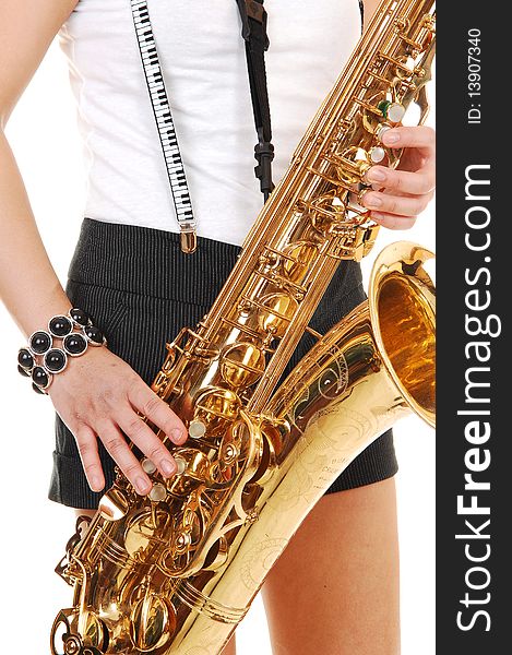 A young Asian woman standing in the studio, playing the saxophone in shorts with suspender, in closeup, for white background. A young Asian woman standing in the studio, playing the saxophone in shorts with suspender, in closeup, for white background.