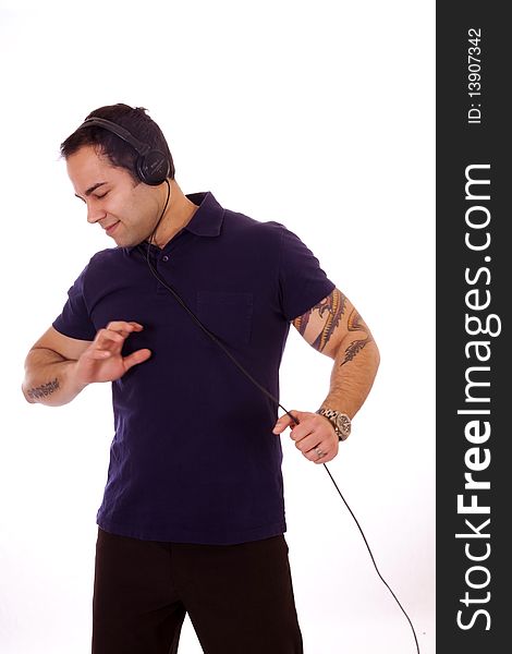 Man dancing to music with headphones on.