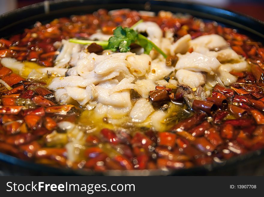 Pepper and fish in a wblack plate,taken in china. Pepper and fish in a wblack plate,taken in china