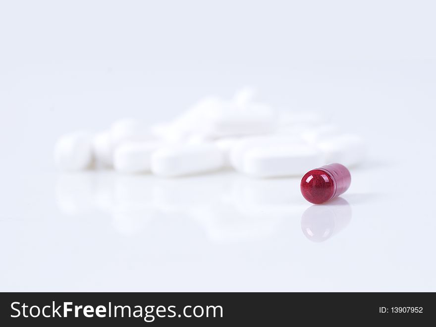 Capsule and bottle on the table. Capsule and bottle on the table