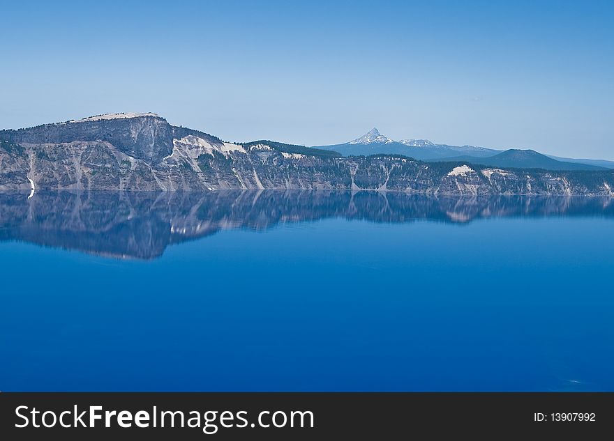Crater Lake in Oregon with a perfect reflection on a calm sunny day