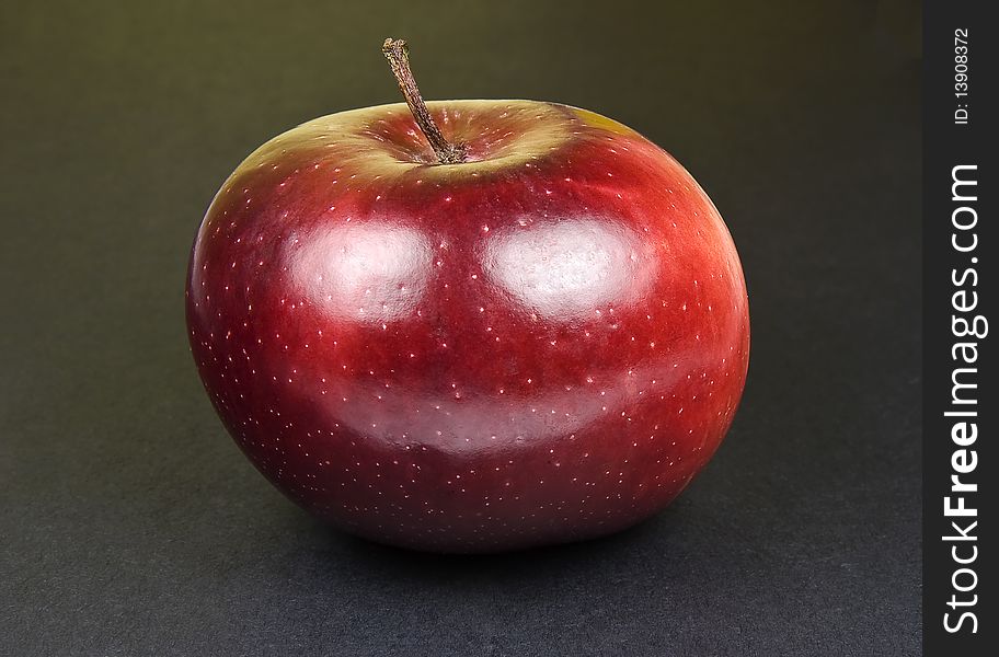 Happy Red Delicious Apple on black background