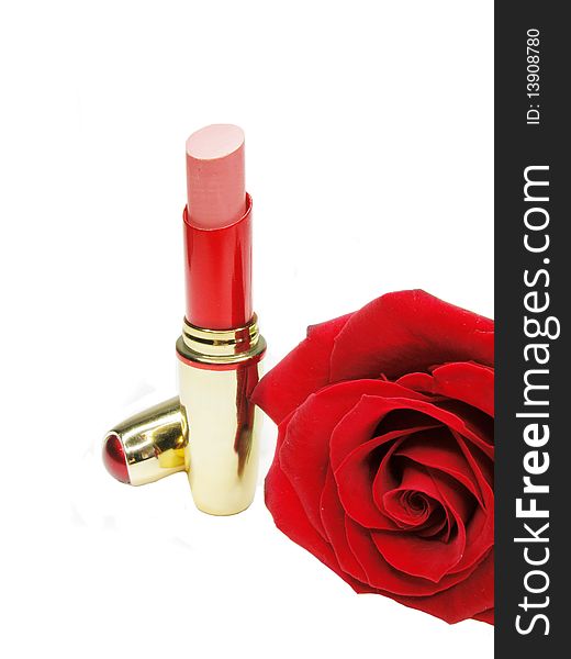 Red lipstick in gold box with damask rose on background. Red lipstick in gold box with damask rose on background