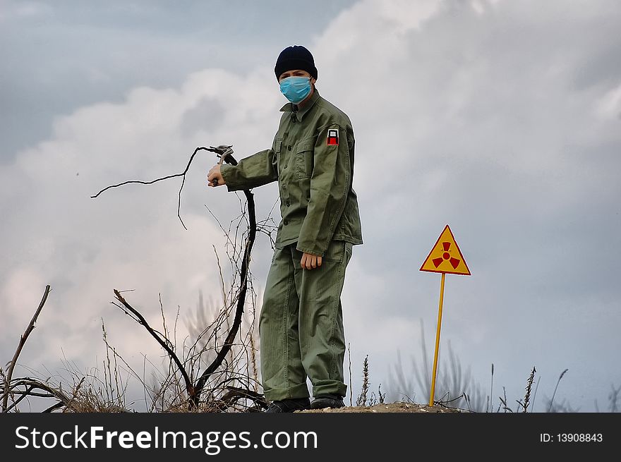 Teenager weared American military uniform.Lost city. Near Chernobyl area. Modern ruins. Ukraine. Kiev region. Teenager weared American military uniform.Lost city. Near Chernobyl area. Modern ruins. Ukraine. Kiev region