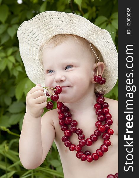 Girl with red cherry beads and earrings