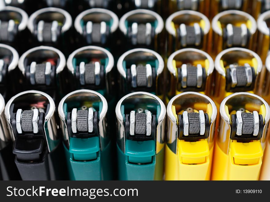 Plastic lighters array with shallow depth of field. Plastic lighters array with shallow depth of field