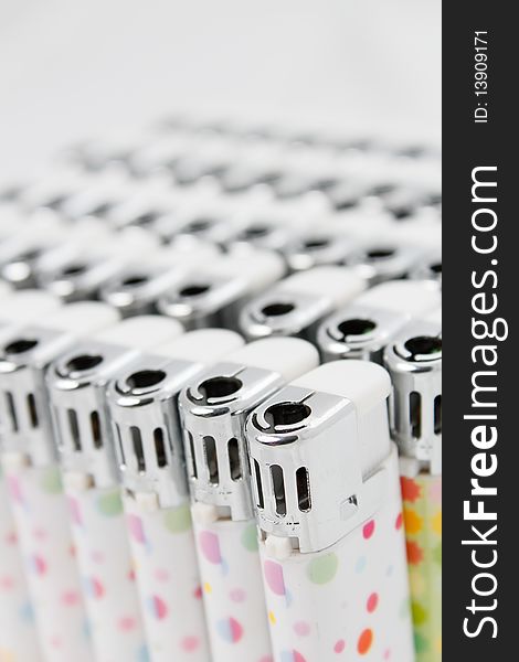 Plastic lighters array with shallow depth of field. Plastic lighters array with shallow depth of field
