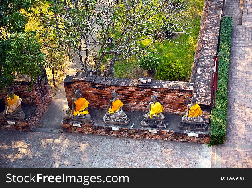 Buddha statues at the temple of Wat Yai Chai Mongkol in Ayutthaya near Bangkok, Thailand. Buddha statues at the temple of Wat Yai Chai Mongkol in Ayutthaya near Bangkok, Thailand