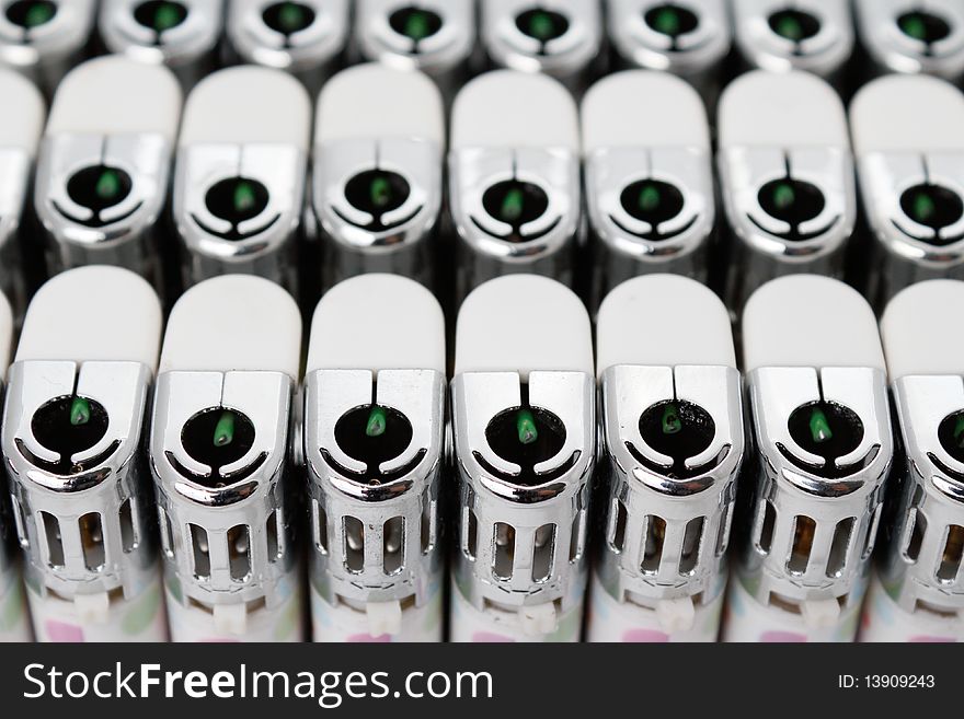 Plastic lighters array with shallow depth of field. Plastic lighters array with shallow depth of field