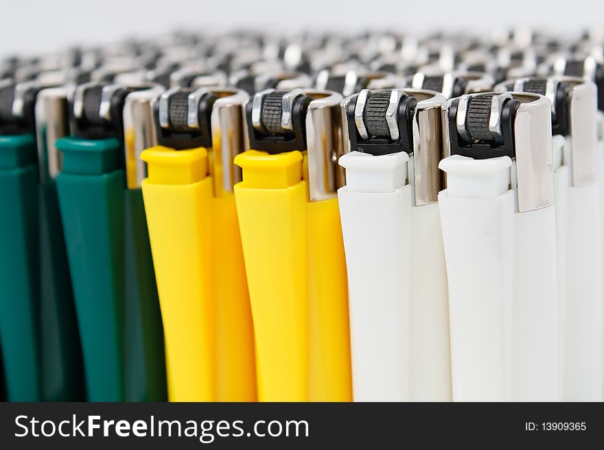 Plastic lighters array with shallow depth of field. Plastic lighters array with shallow depth of field