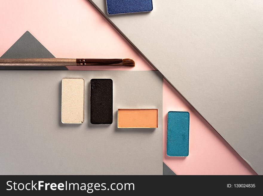 Elegant make up stills, on pastel geometric geometric background. from above. Elegant make up stills, on pastel geometric geometric background. from above