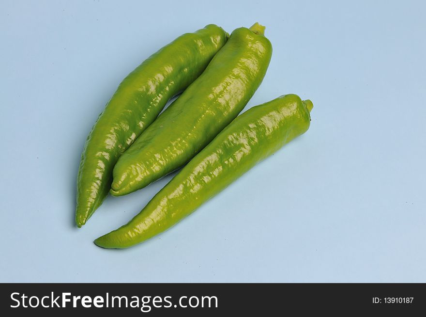 Light blue background of green pepper