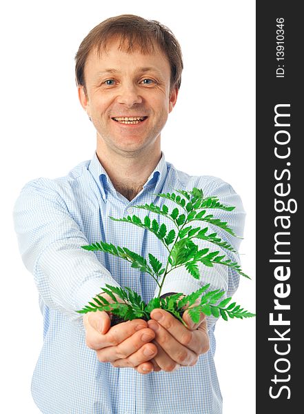 The businessman with a green plant isolated on a white background