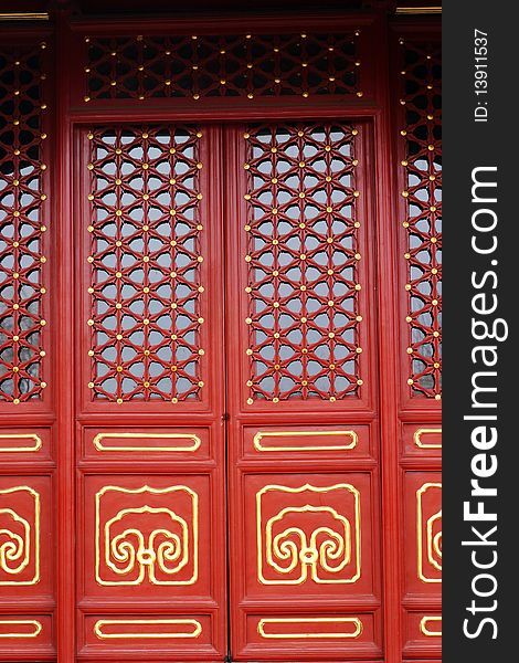 Decorative red door of a chinese ancient royal buddha temple