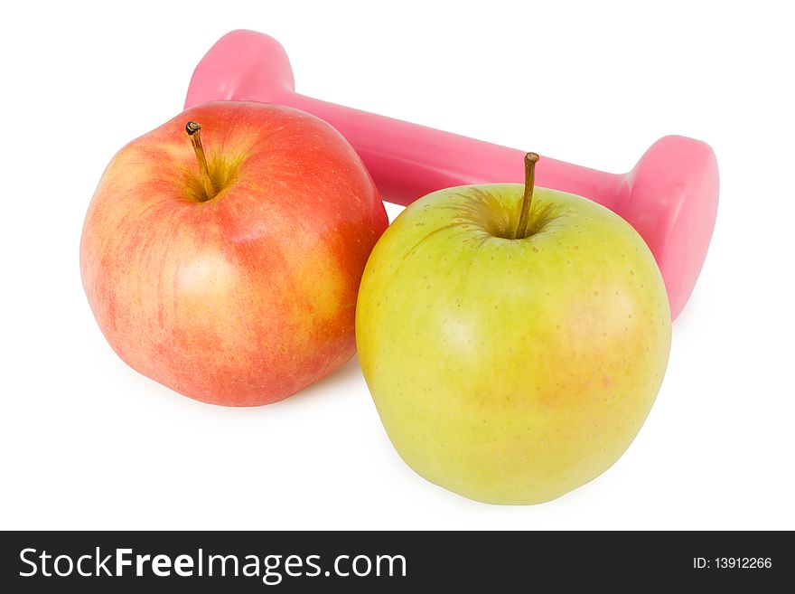 Pink dumbbells and two apples on a white background. Pink dumbbells and two apples on a white background