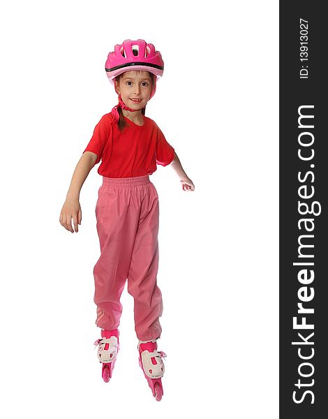 The little girl on rollers and in a helmet on a white background. The little girl on rollers and in a helmet on a white background