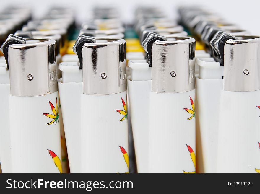 Plastic lighters array with shallow depth of field. Plastic lighters array with shallow depth of field
