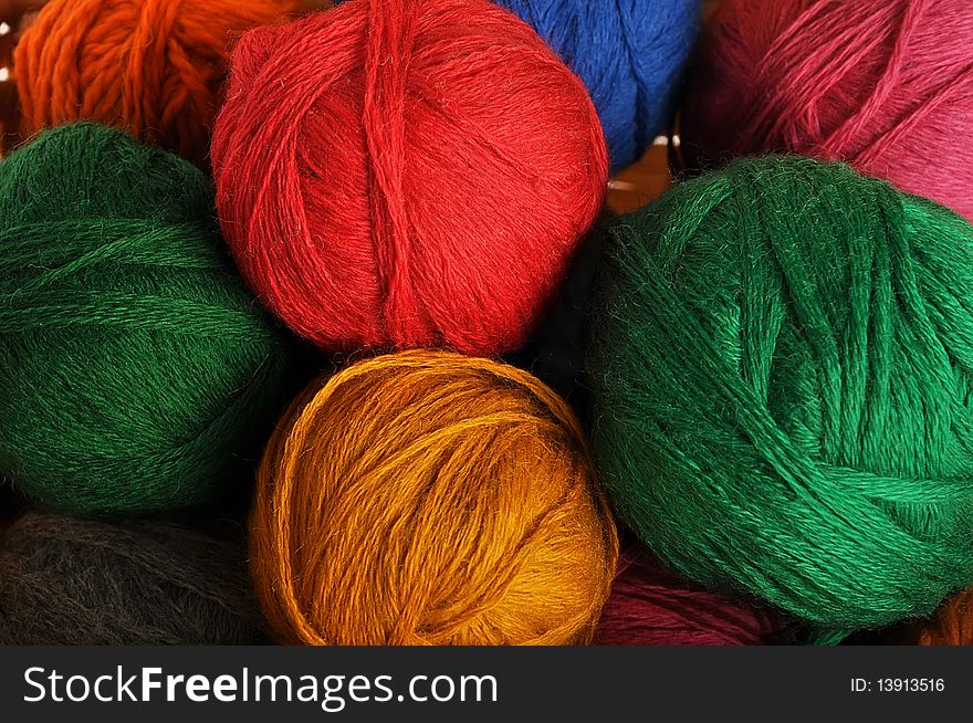 Multi-coloured balls of wool