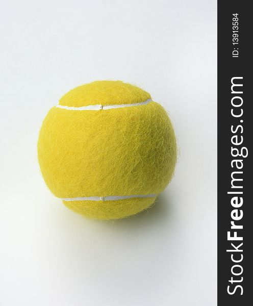 Yellow tennis ball on a white background