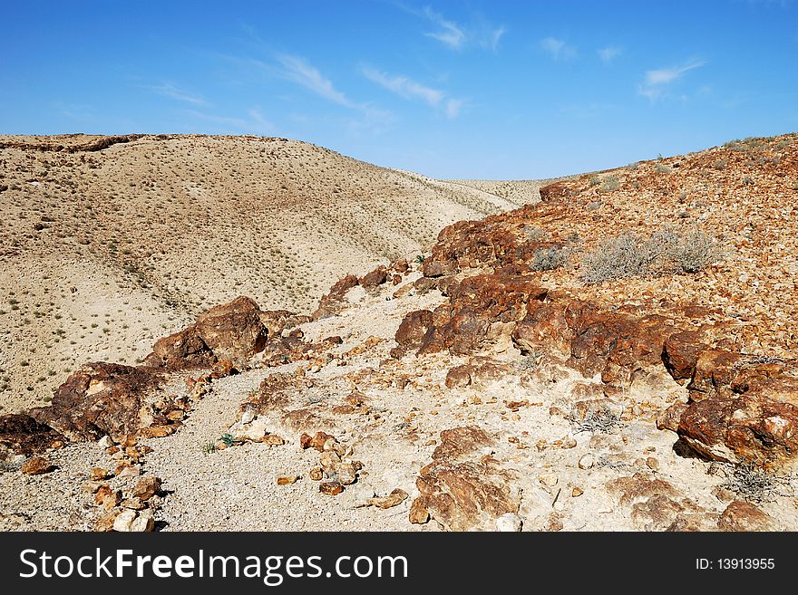 Ancient rocks under blue sky. Desert Negev, Israel. Ancient rocks under blue sky. Desert Negev, Israel.