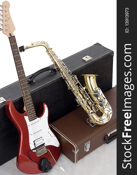 Red Electric Guitar And Gold Sax