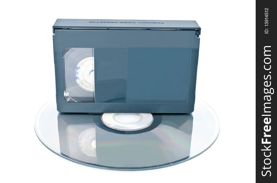 Compact videocassette and digital disc isolated on white background. Compact videocassette and digital disc isolated on white background