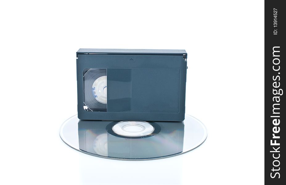 Compact videocassette and digital disc isolated on white background. Compact videocassette and digital disc isolated on white background