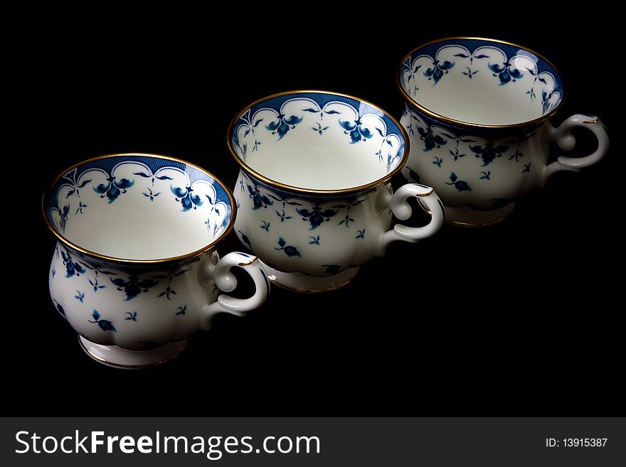 Three tea cups on saucer insulated on white background