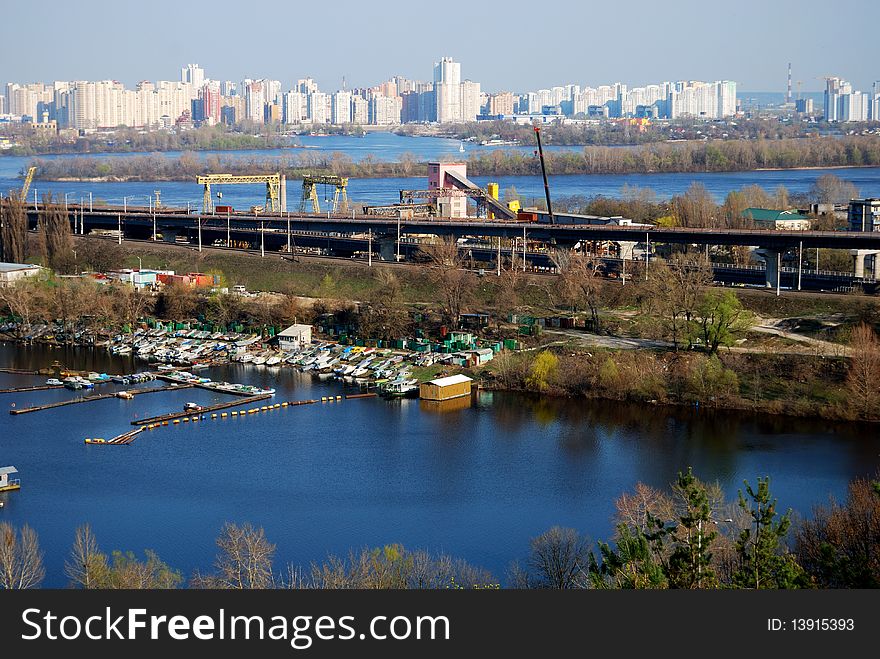 View on Kiev Left bank, yacht station, bridge and a concrete factory. View on Kiev Left bank, yacht station, bridge and a concrete factory