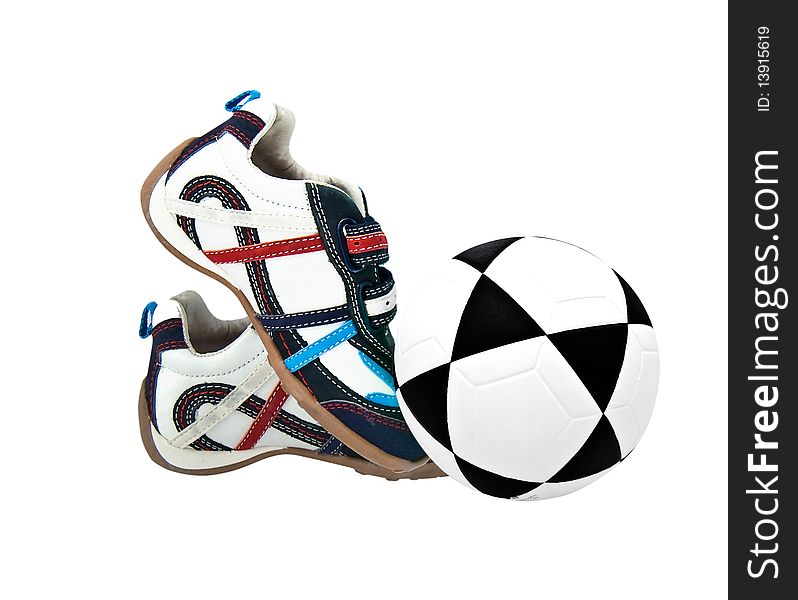 Sneakers for the child on a white background and a football. Sneakers for the child on a white background and a football